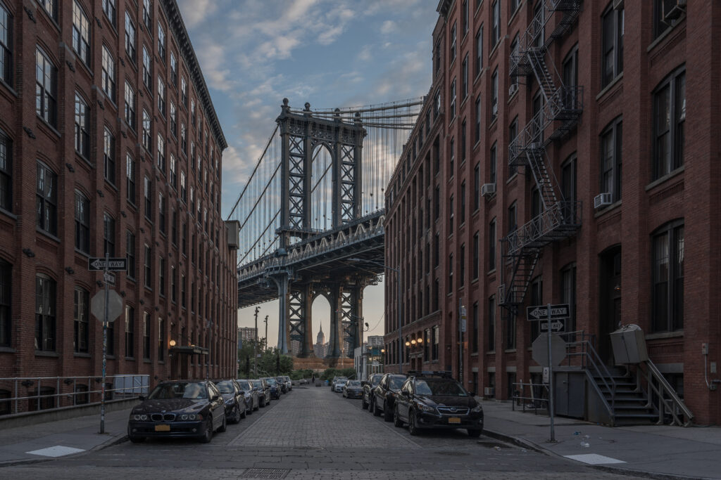 view city street against manhattan bridge