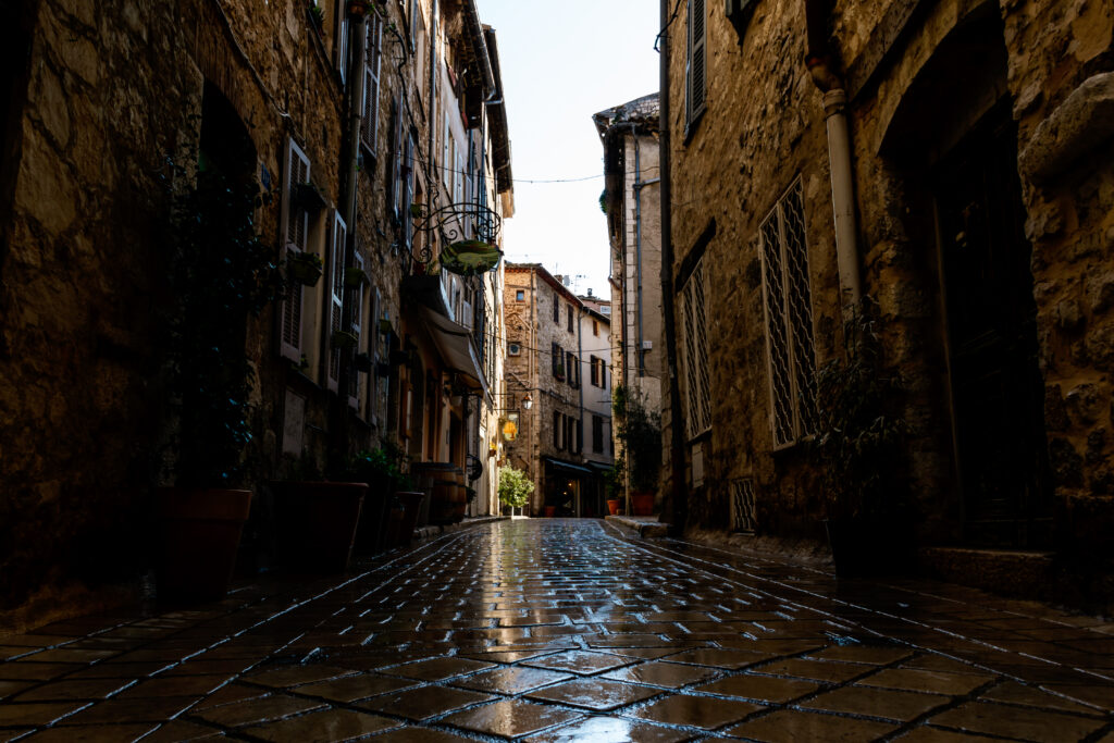 a narrow small street in the old medieval center of a french tow